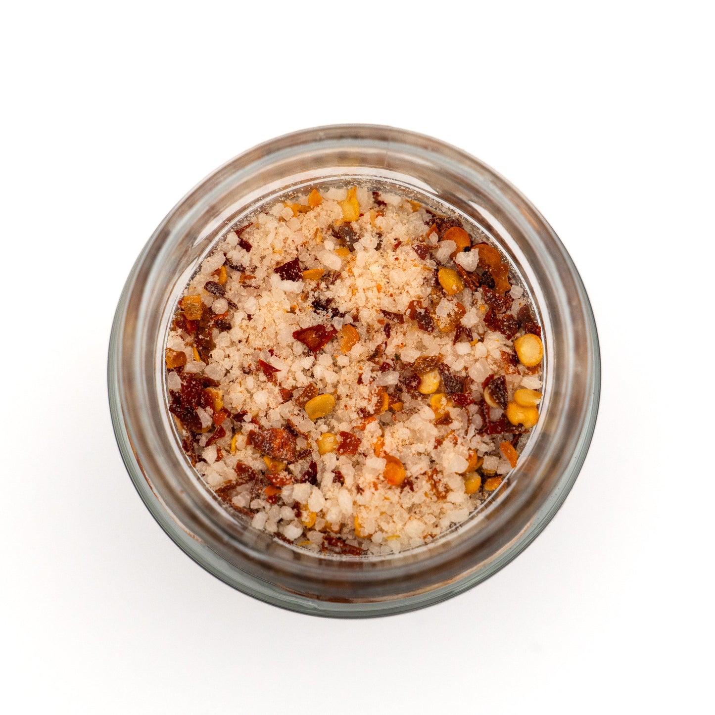 Offenes Glas Chilisalz – rote Chiliflocken im Meersalz, kräftige Farbe